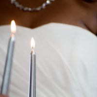 bride lighting candle ceremony in italy